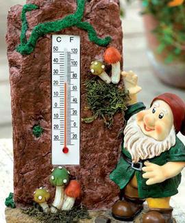 Trädgårdstomte med termometer