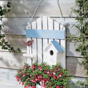 Dekorativ planteringslåda med fuchsior